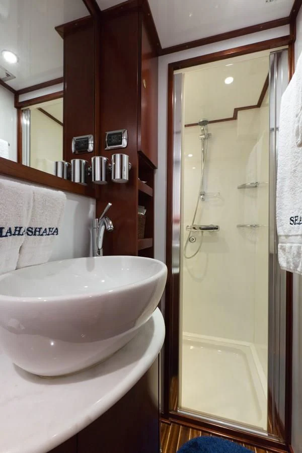 a bathroom with a sink and a shower aboard SHAHA Yacht for Sale
