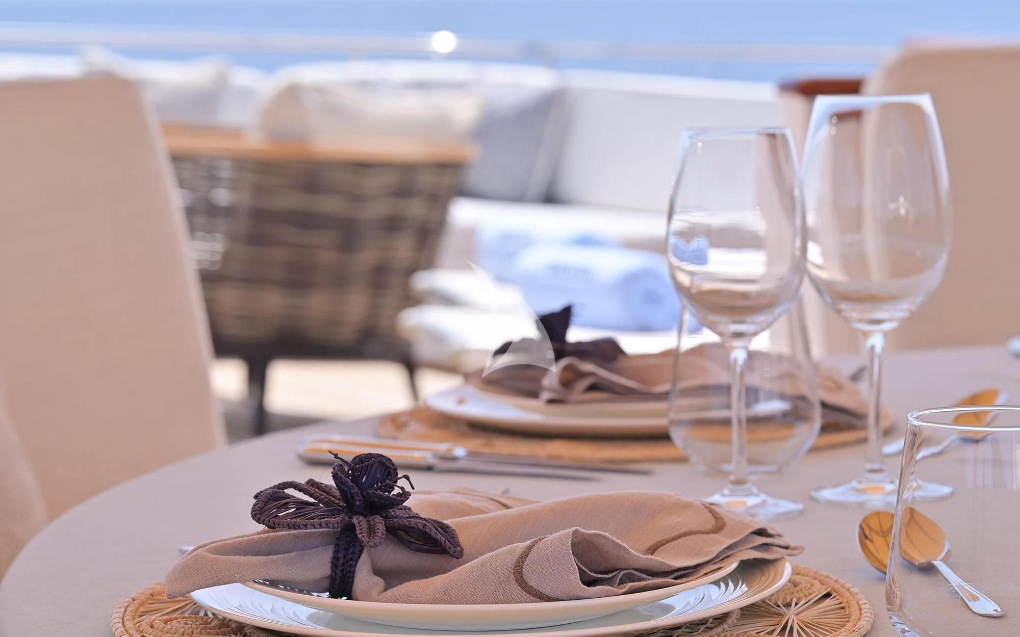 a table with plates and glasses on it aboard SHAHA Yacht for Sale