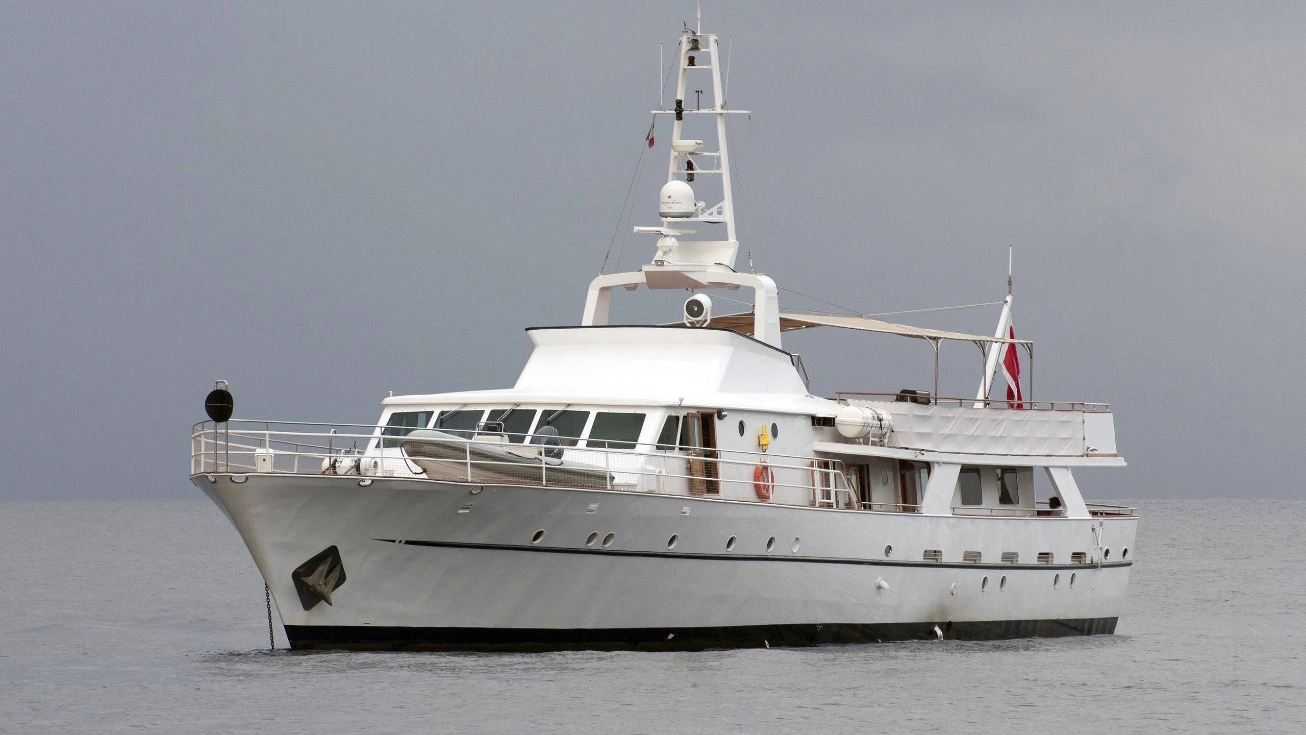 a white boat on the water aboard SHAHA Yacht for Sale