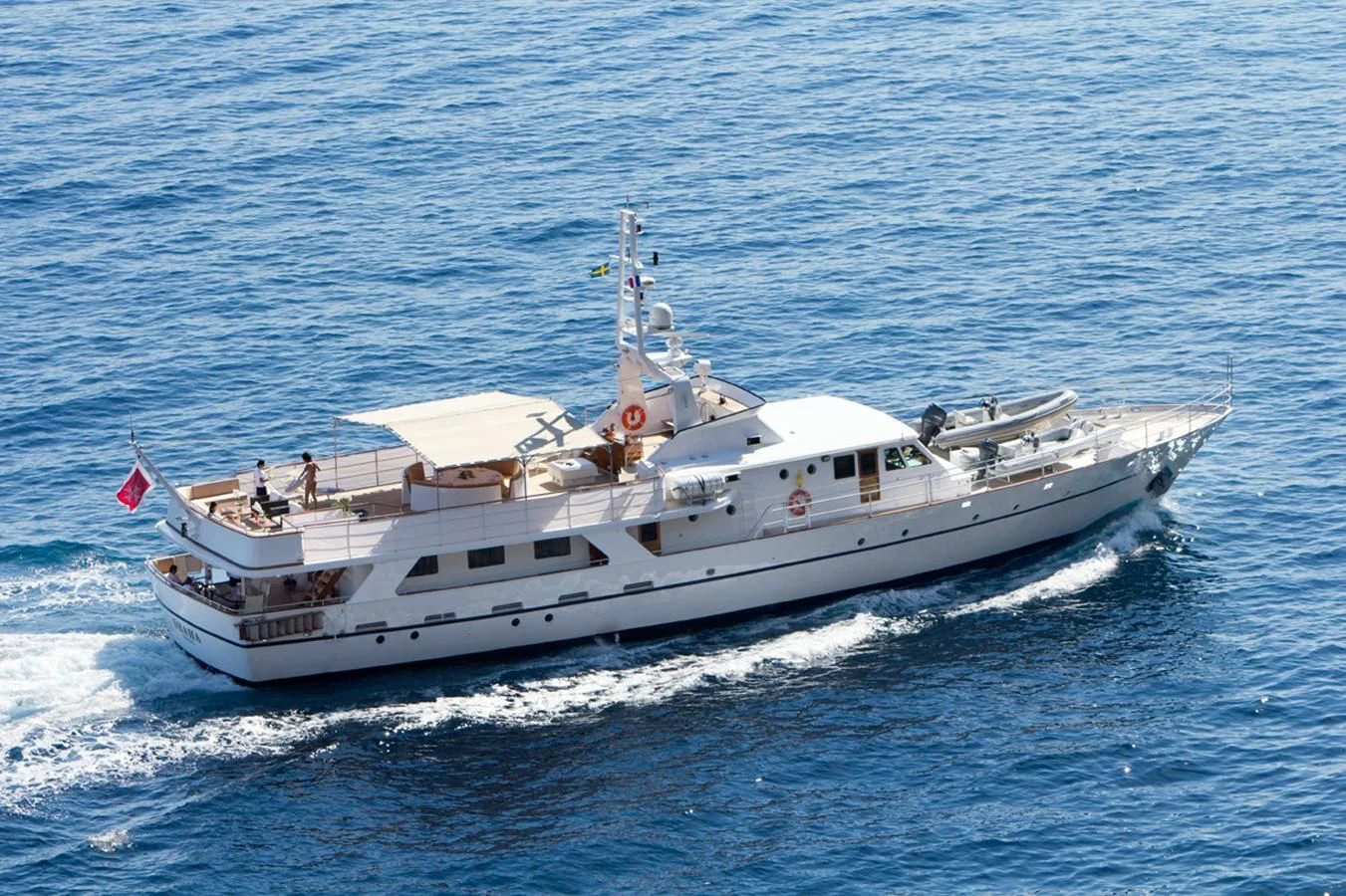a large white boat in the water aboard SHAHA Yacht for Sale