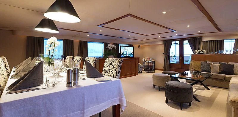 a large room with a large white table and a large white table with chairs and a large white aboard SHAHA Yacht for Sale