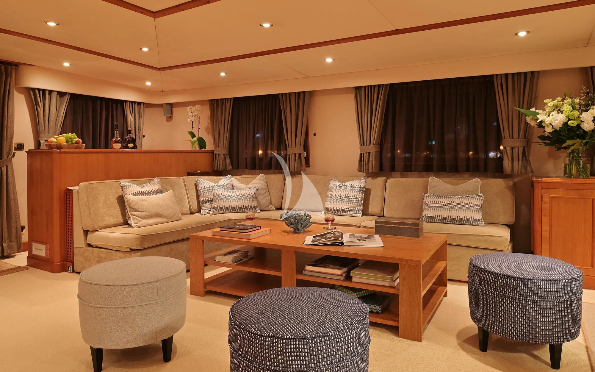 a living room with a couch and a coffee table aboard SHAHA Yacht for Sale