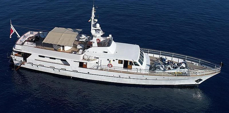 a large white ship in the water aboard SHAHA Yacht for Sale