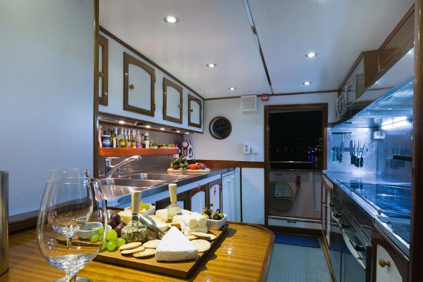 a kitchen with a table and a dishwasher aboard SHAHA Yacht for Sale