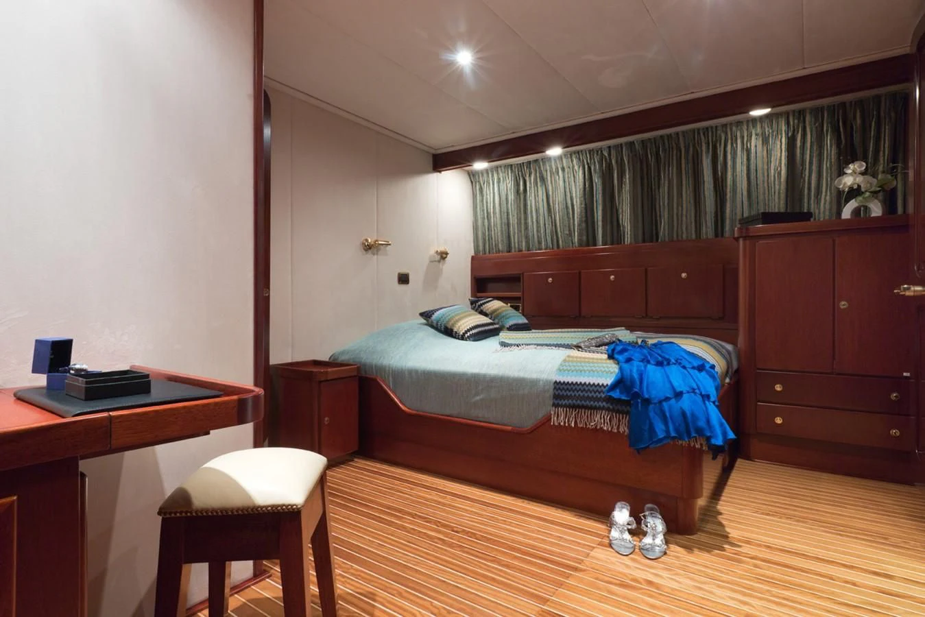 a bedroom with a bed and desk aboard SHAHA Yacht for Sale
