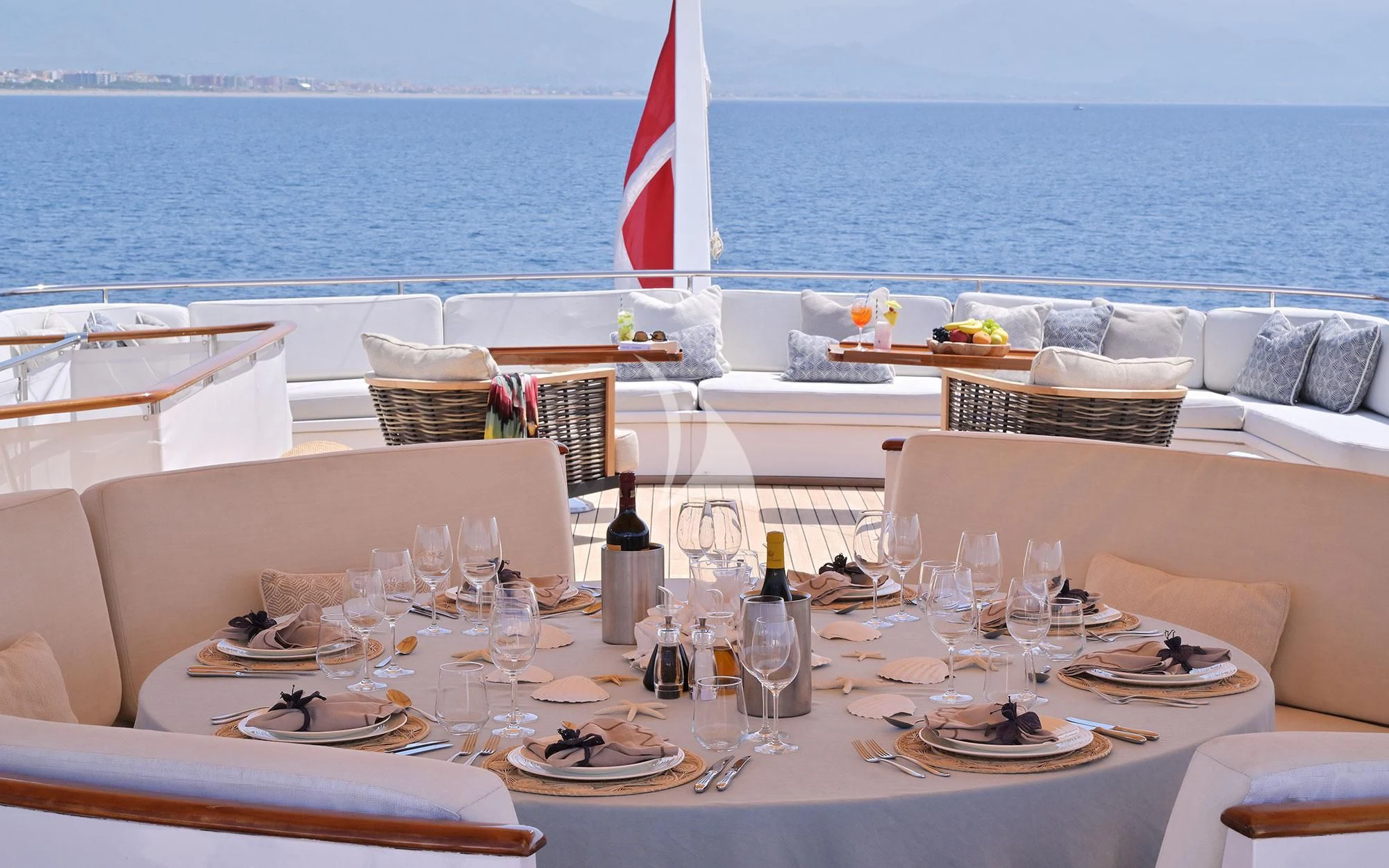 a table set for a dinner party aboard SHAHA Yacht for Sale