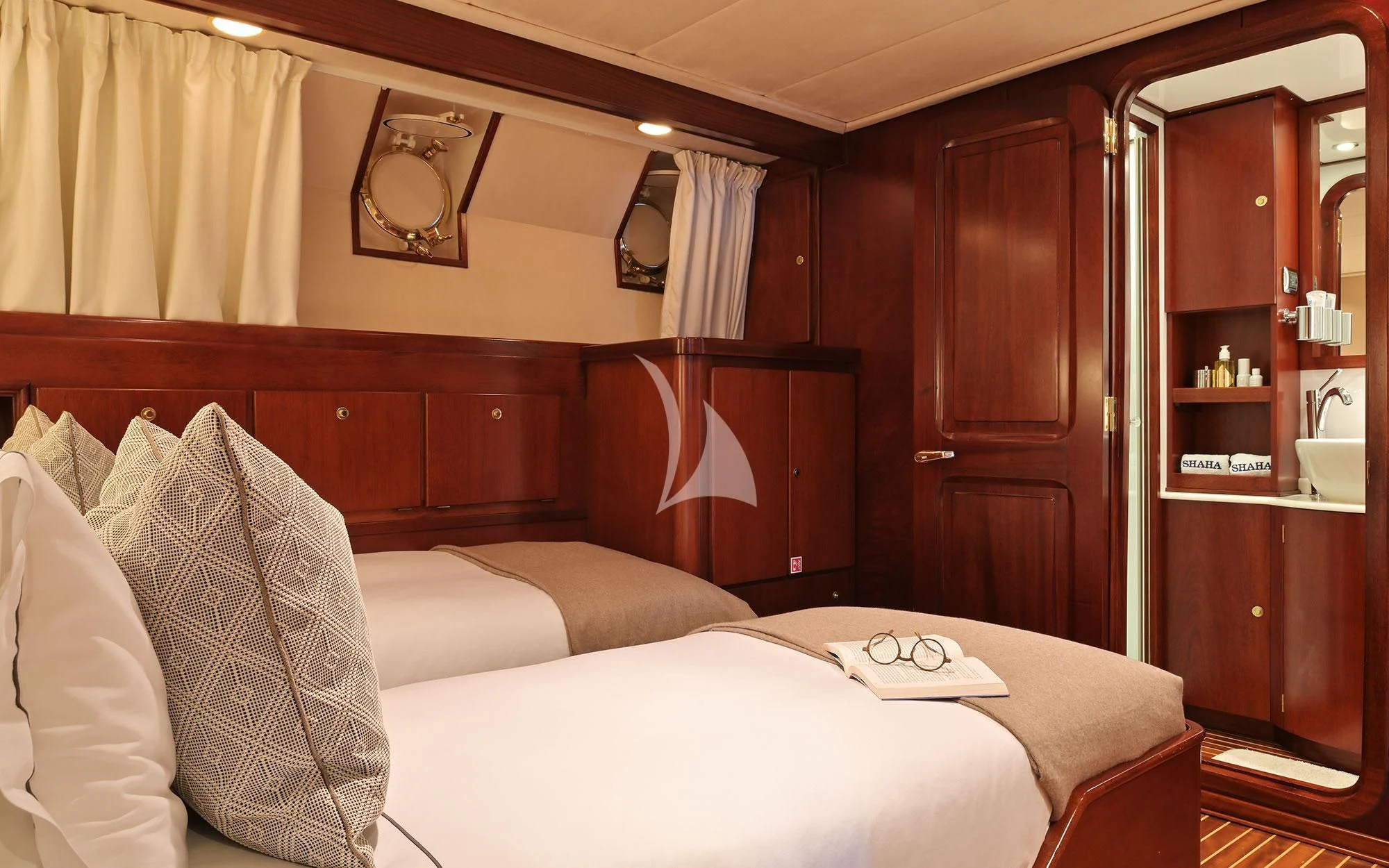 a room with a bed and a closet aboard SHAHA Yacht for Sale