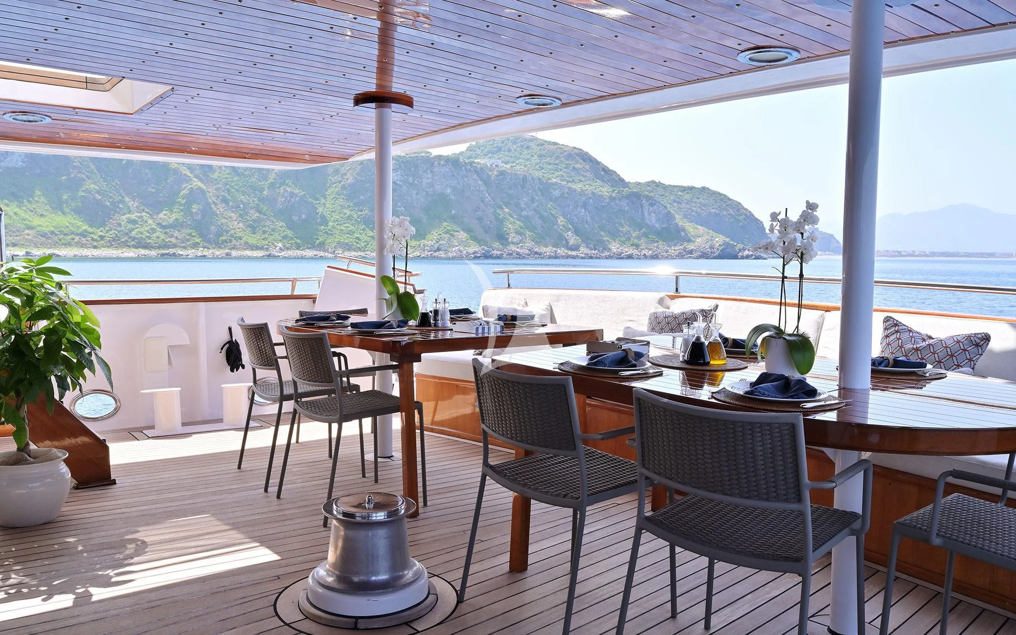 a table and chairs on a patio aboard SHAHA Yacht for Sale