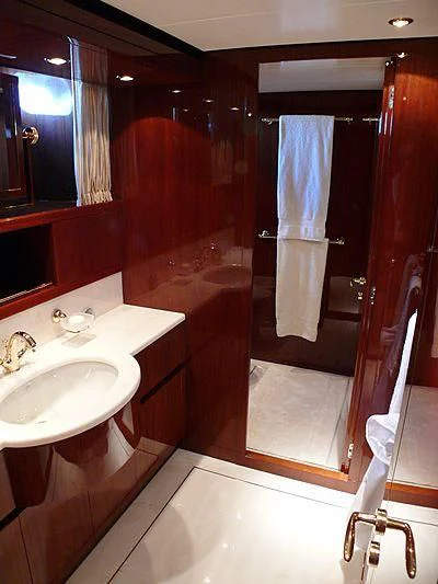 a bathroom with a sink and a mirror aboard ARGO B Yacht for Sale