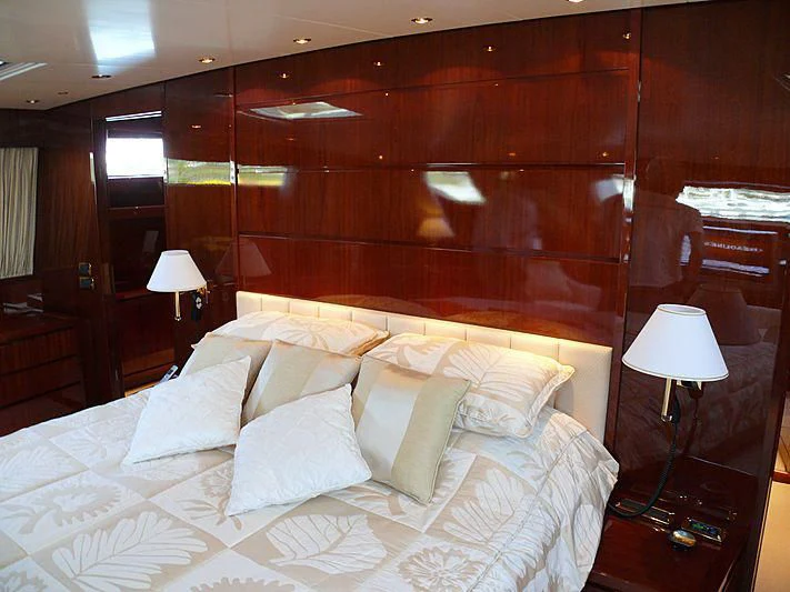 a bed with white sheets aboard ARGO B Yacht for Sale