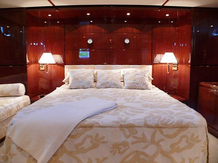a bed with white sheets aboard ARGO B Yacht for Sale