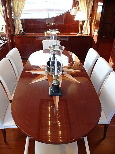 a table with a lamp on it aboard ARGO B Yacht for Sale