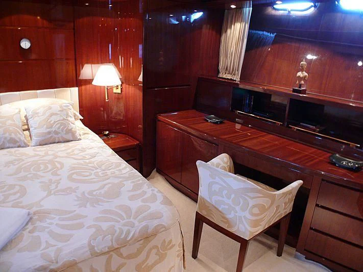 a room with a piano and a bed aboard ARGO B Yacht for Sale