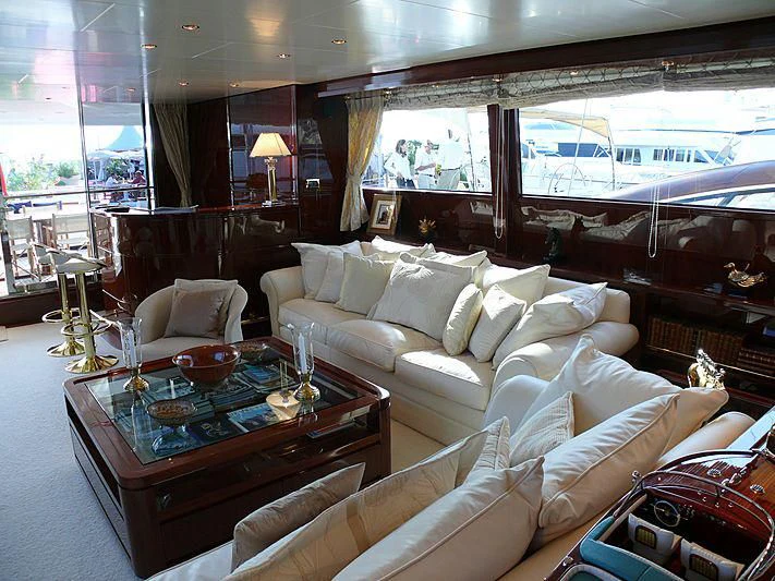 a living room with a large window aboard ARGO B Yacht for Sale