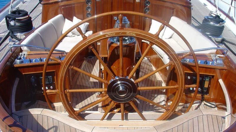 a wooden steering wheel aboard MARIA CATTIVA Yacht for Sale