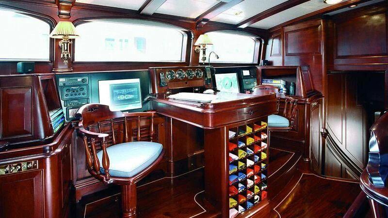 a bar with a table and chairs aboard MARIA CATTIVA Yacht for Sale