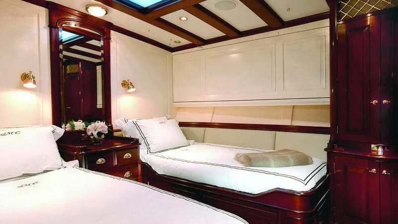 a room with two beds aboard MARIA CATTIVA Yacht for Sale