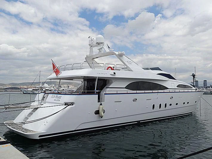 a white yacht on the water aboard OUZO PALACE Yacht for Sale