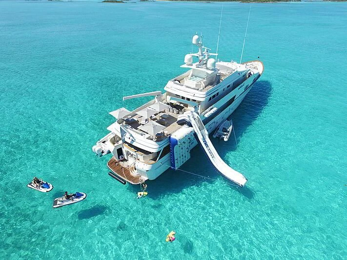 a helicopter flying over a boat aboard BG Yacht for Sale