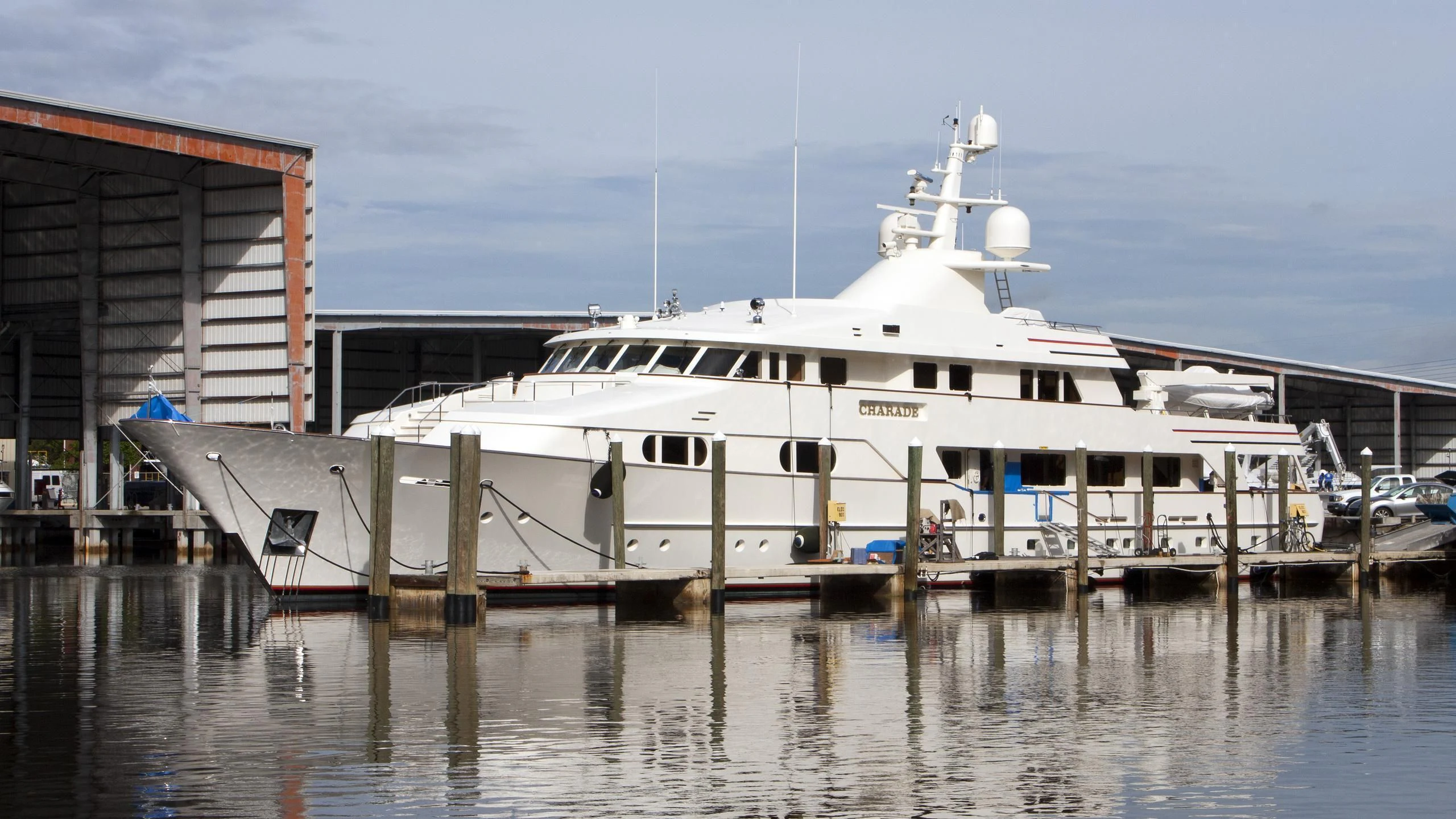 a large white boat docked aboard BG Yacht for Sale