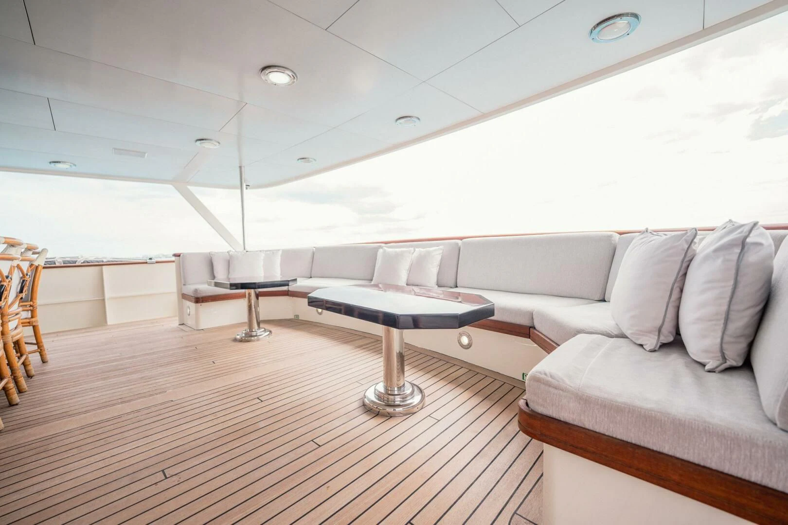 a room with a table and couch aboard BG Yacht for Sale