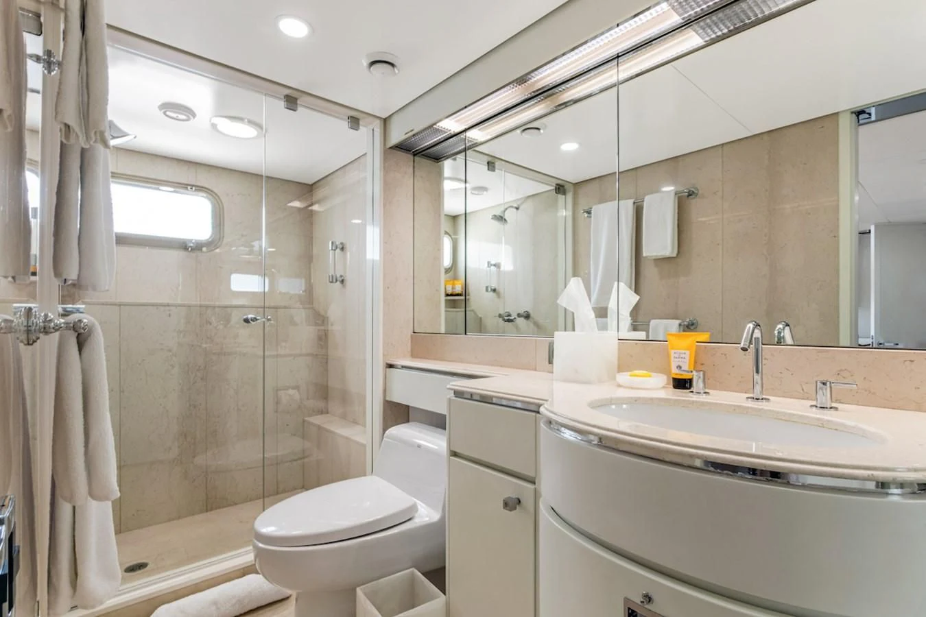 a bathroom with a glass shower aboard BG Yacht for Sale