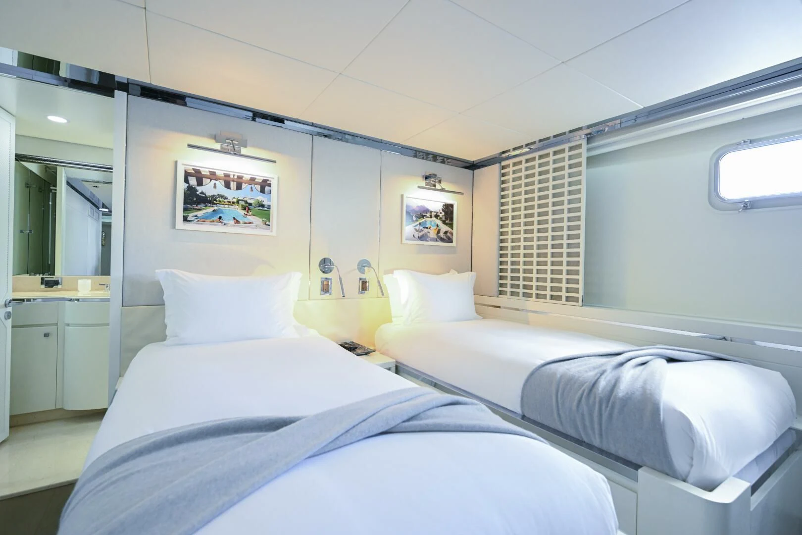 a room with white beds aboard BG Yacht for Sale