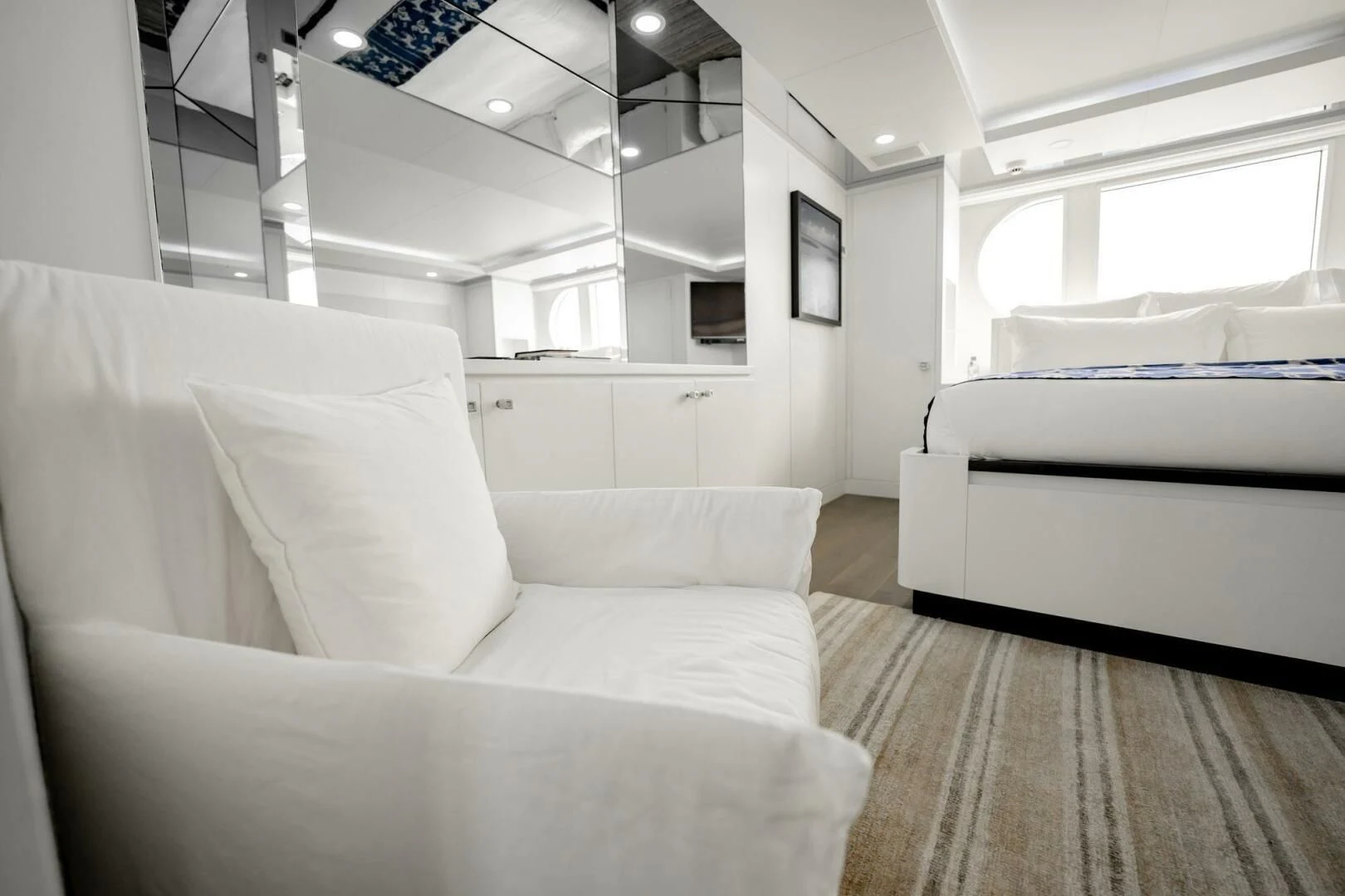 a room with white couches aboard BG Yacht for Sale