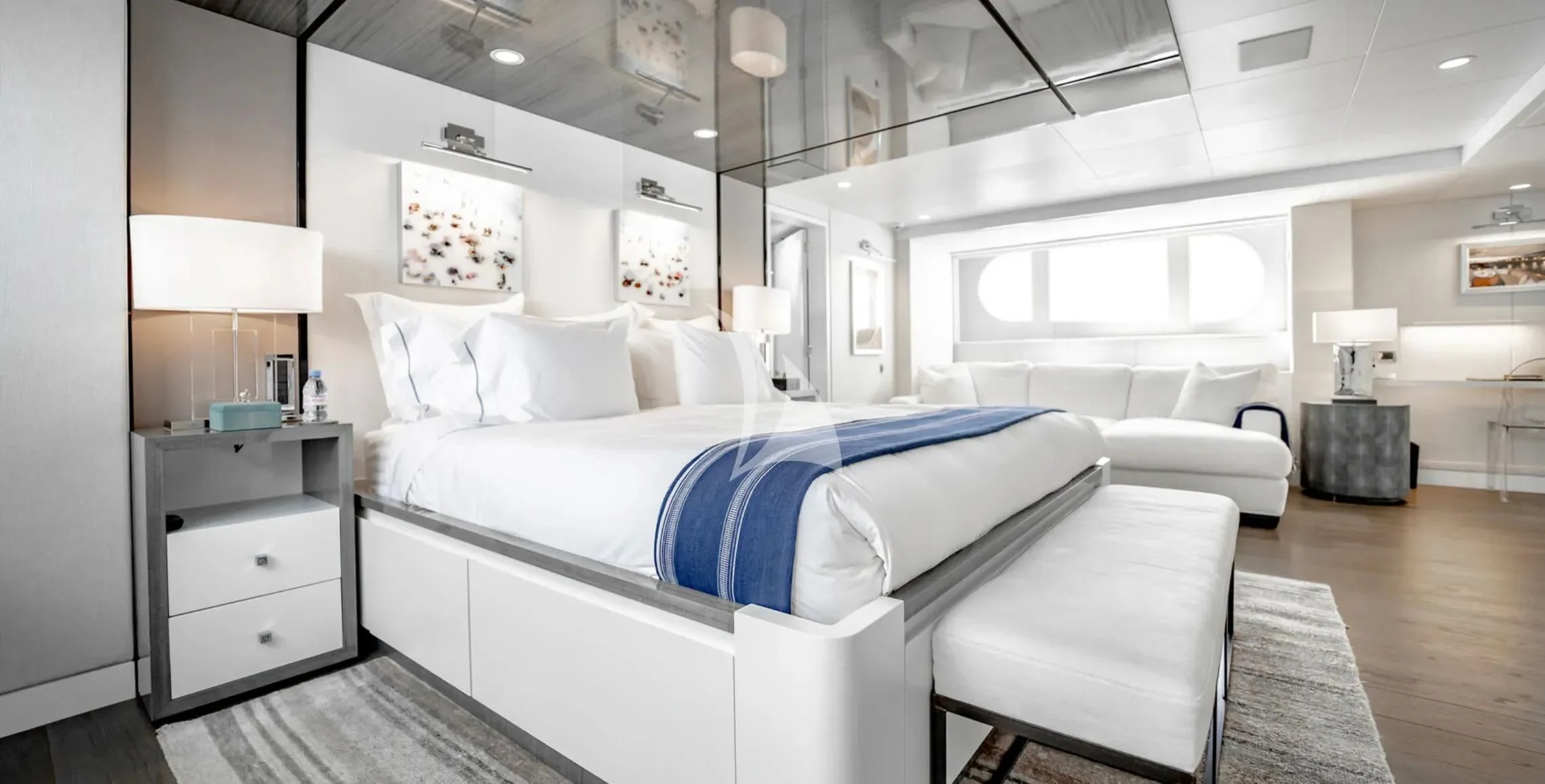 a large white bed in a room aboard BG Yacht for Sale