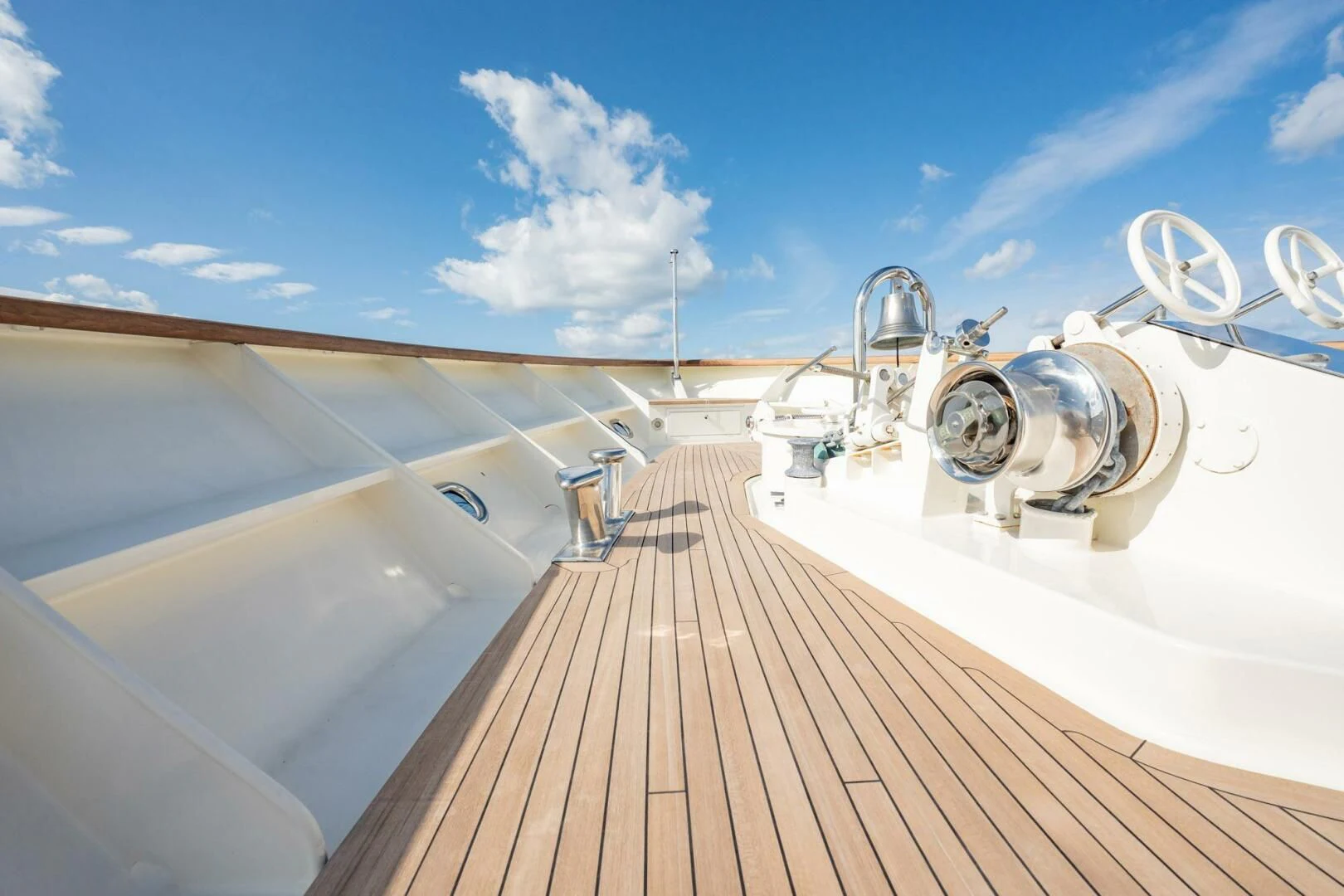 a wooden dock leading to a large body of water aboard BG Yacht for Sale