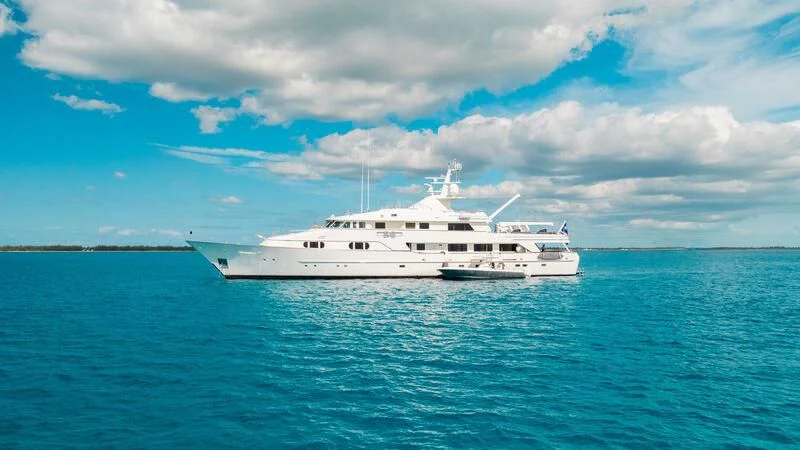 a white boat in the water aboard BG Yacht for Sale
