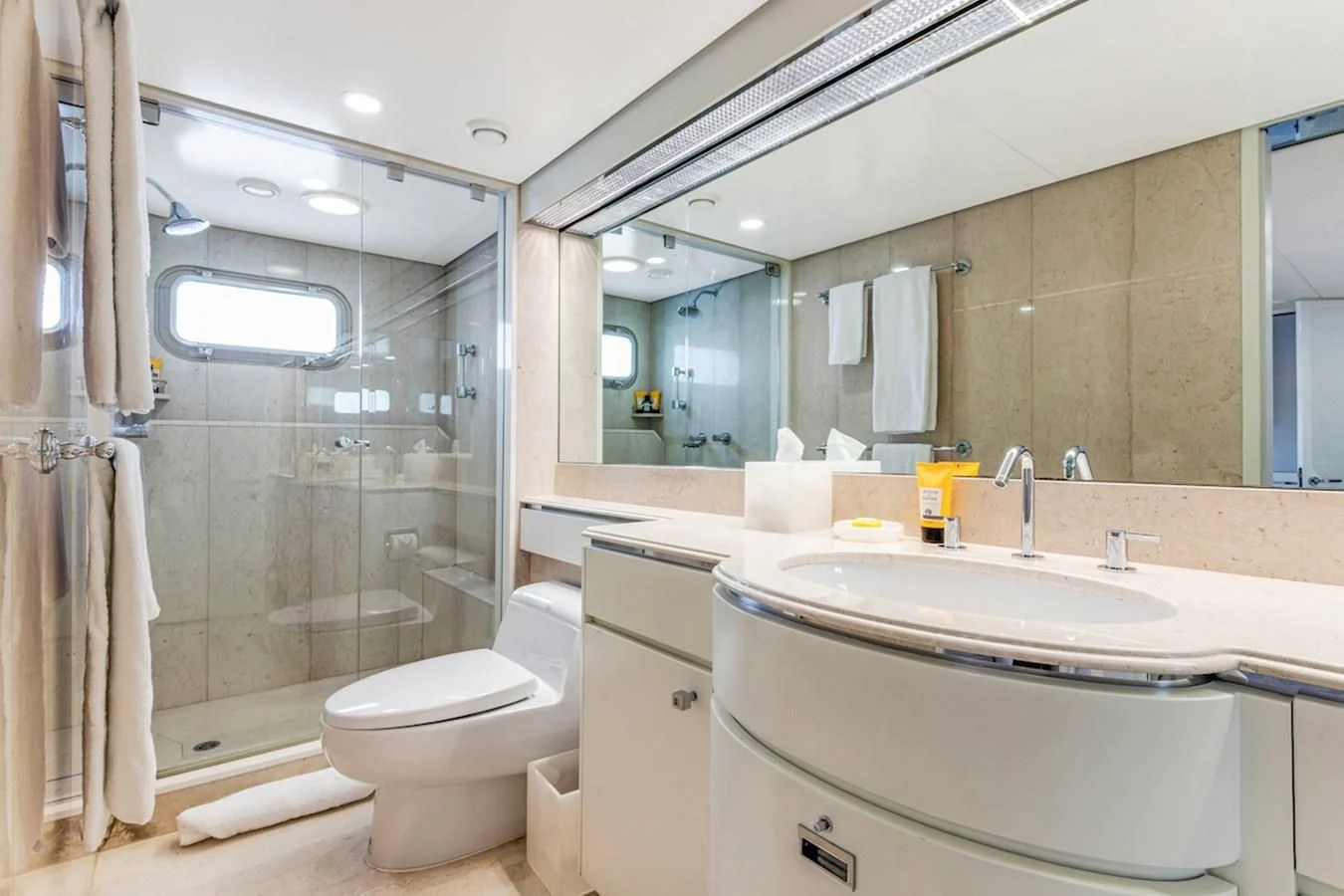 a bathroom with a large mirror aboard BG Yacht for Sale
