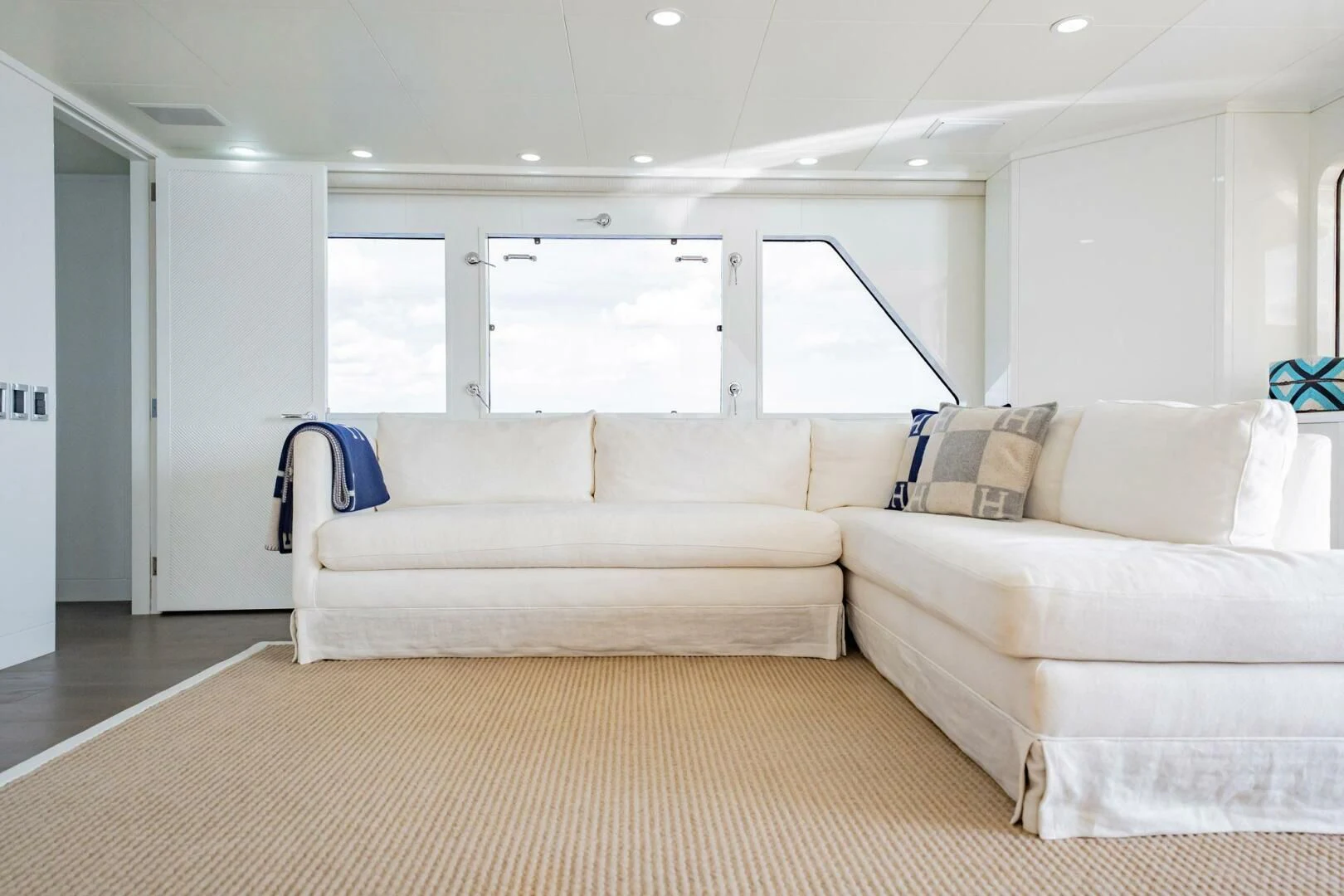 a living room with couches aboard BG Yacht for Sale
