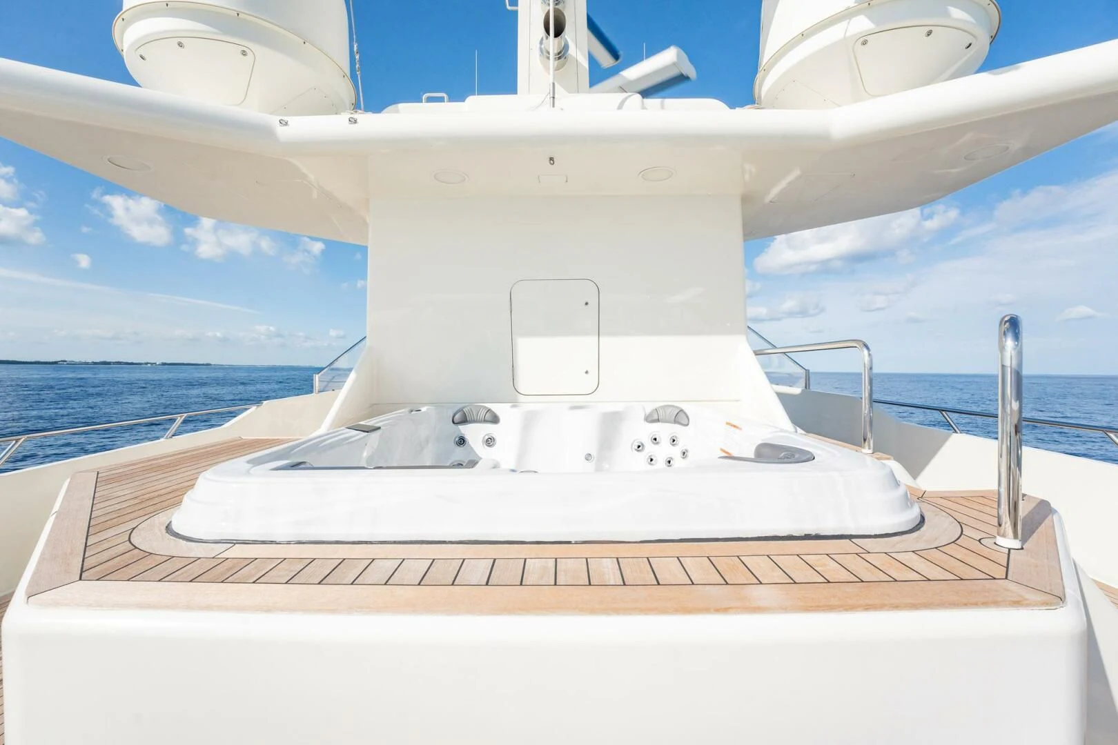 a white boat on a deck aboard BG Yacht for Sale
