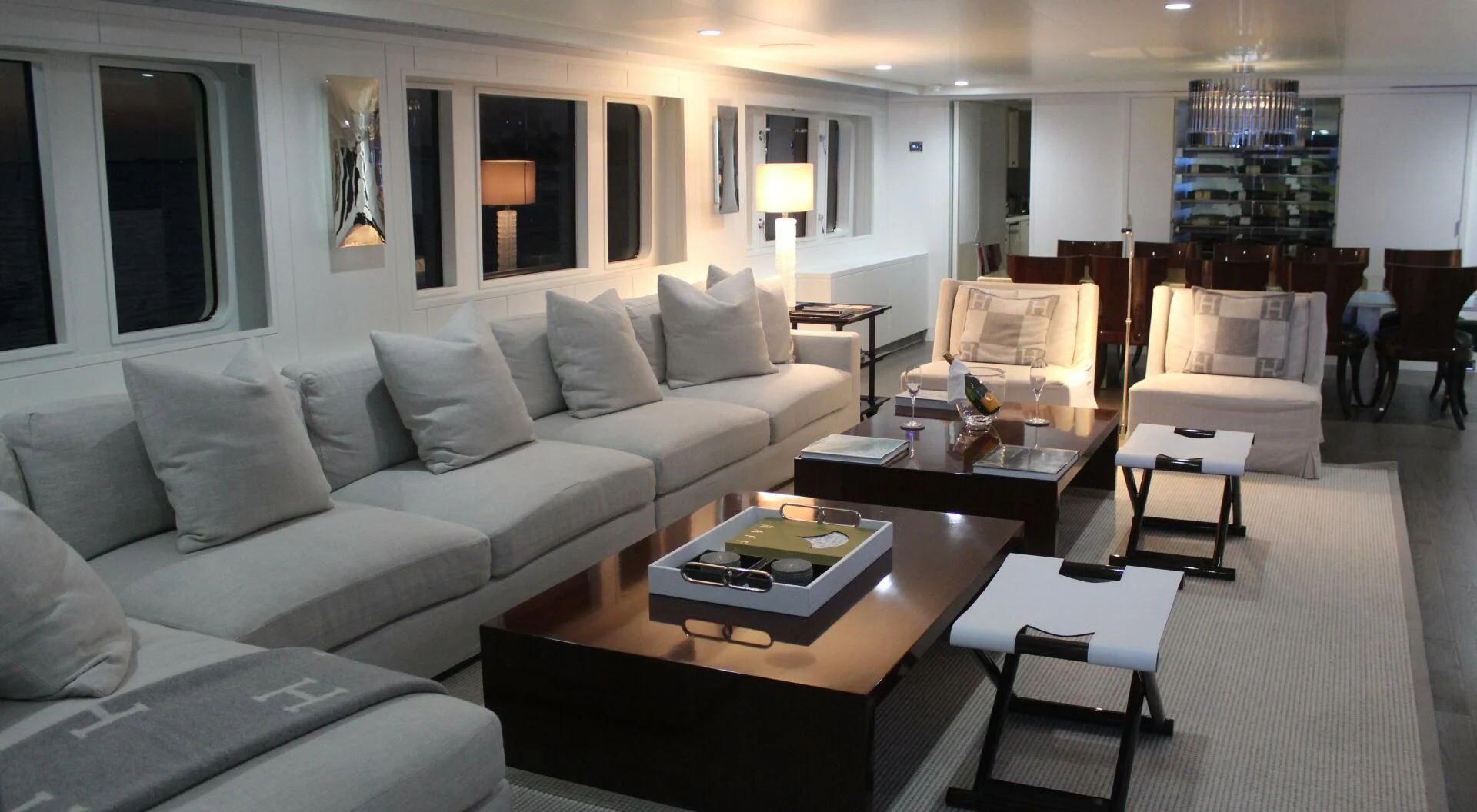a living room with a white couch and a coffee table aboard BG Yacht for Sale