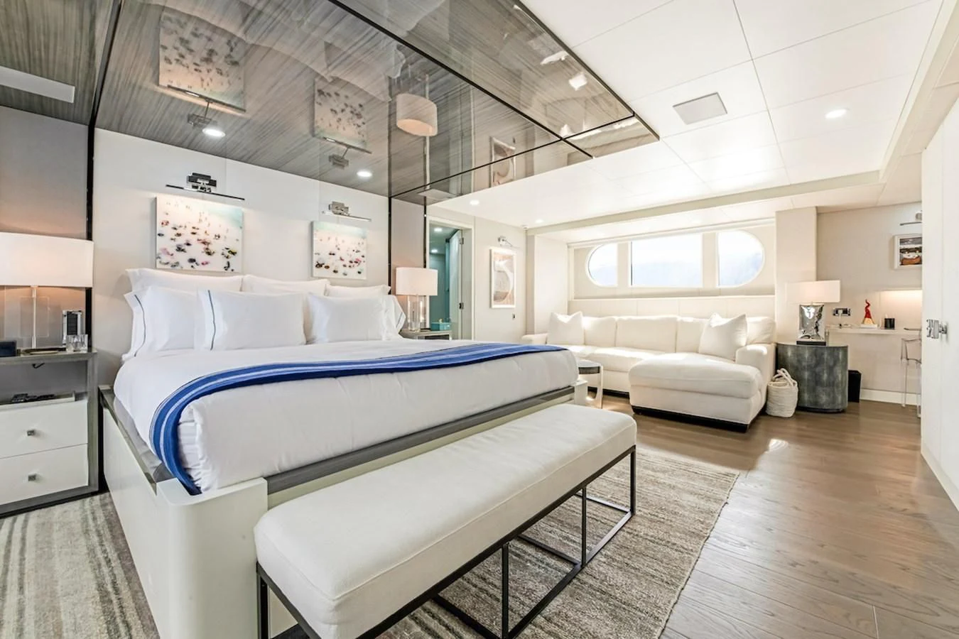 a bedroom with a bed and a couch aboard BG Yacht for Sale
