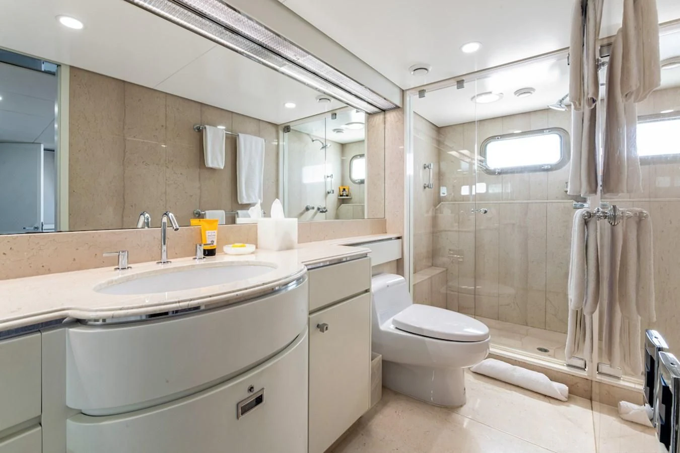 a bathroom with a sink toilet and shower aboard BG Yacht for Sale