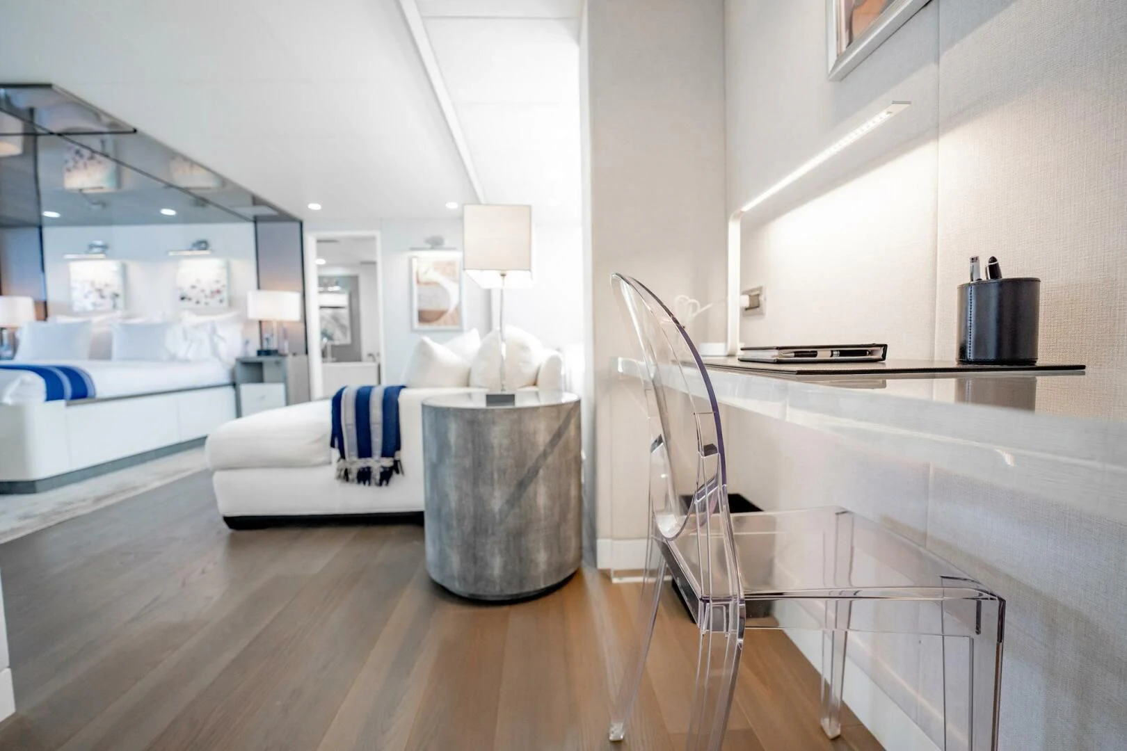 a modern looking bedroom with a wood floor aboard BG Yacht for Sale