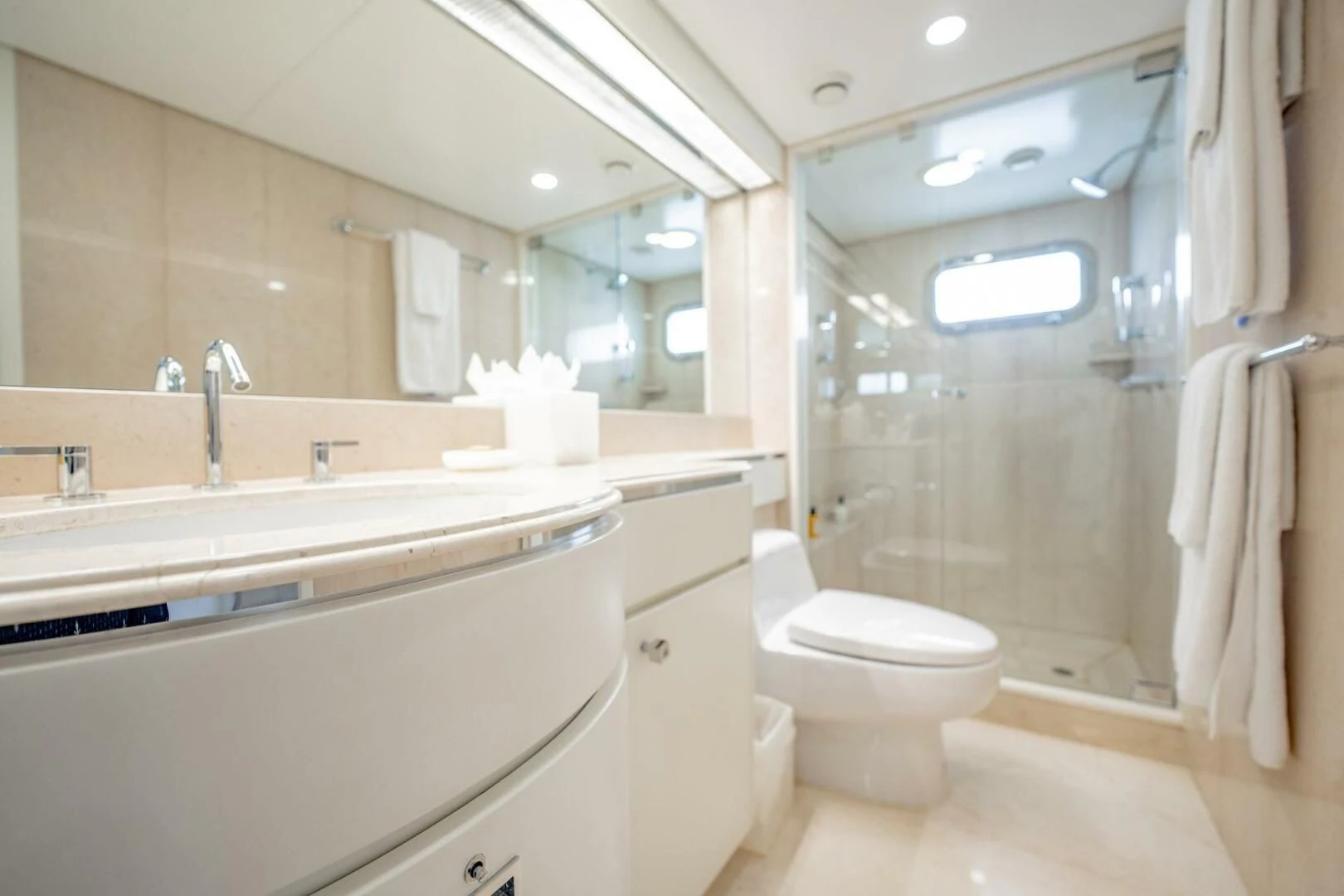 a bathroom with a glass shower aboard BG Yacht for Sale