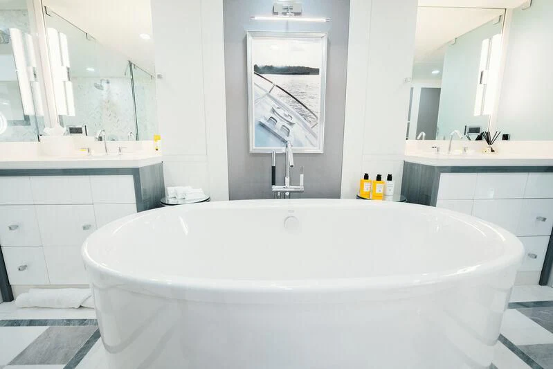 a large white bathtub in a bathroom aboard BG Yacht for Sale