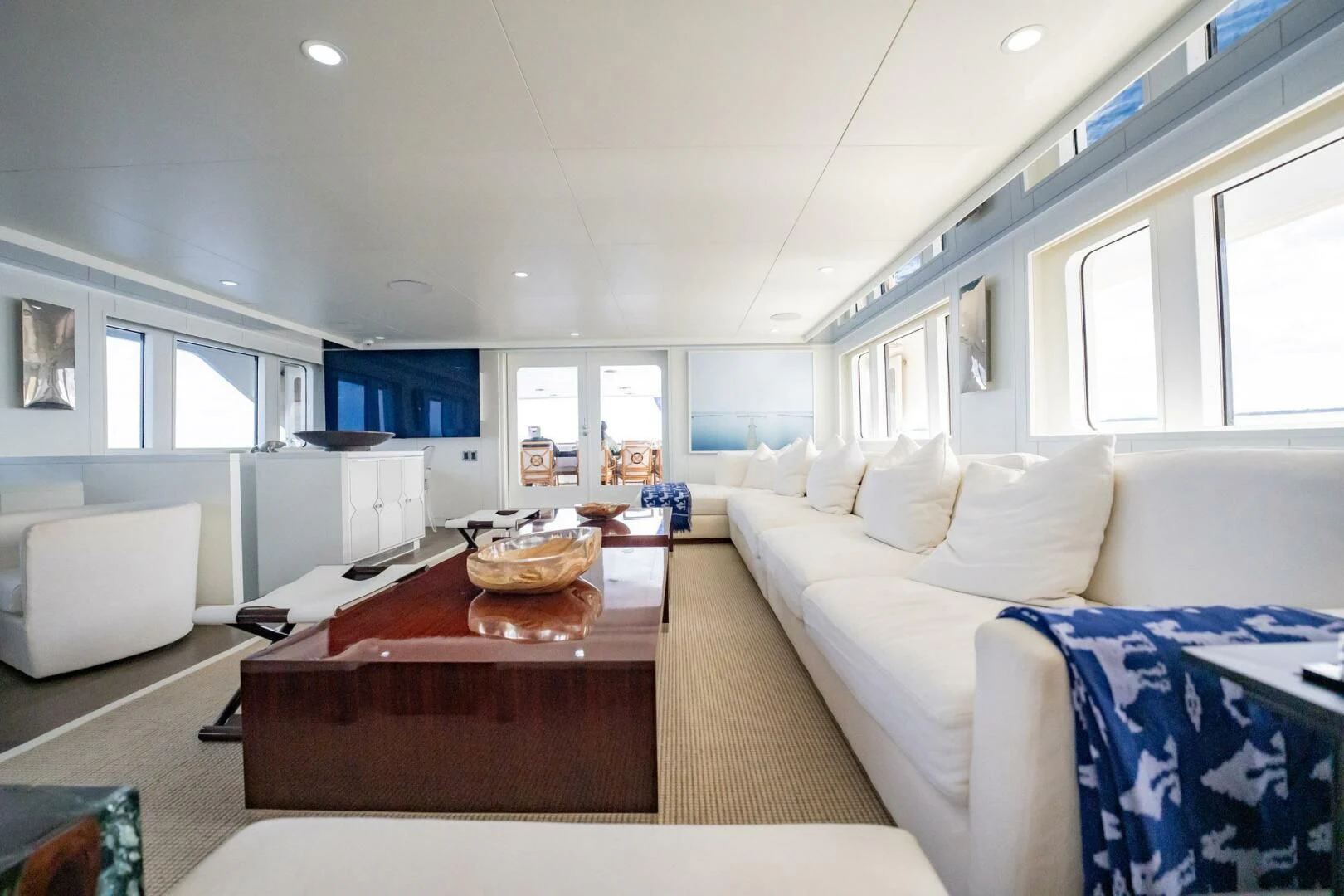 a living room with a couch and a table aboard BG Yacht for Sale