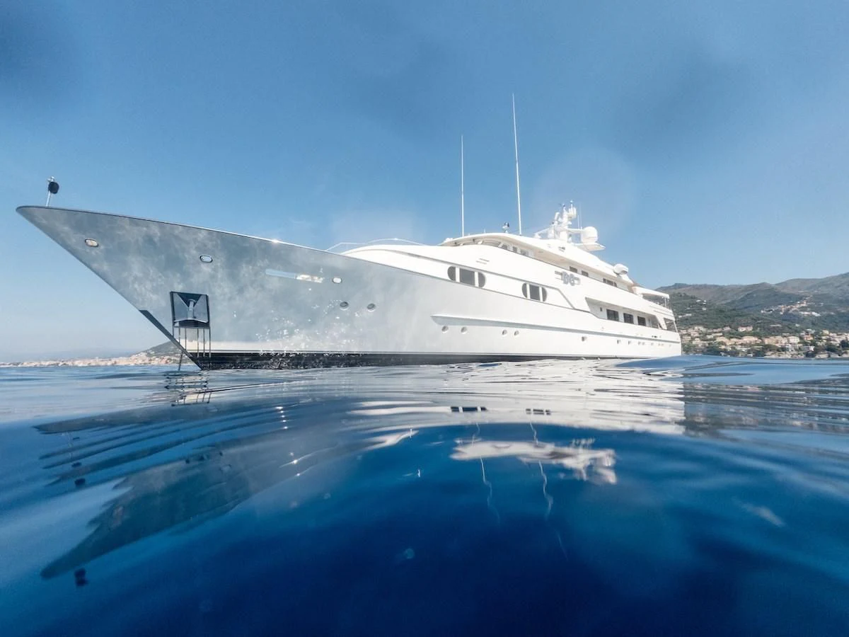 a white boat on the water aboard BG Yacht for Sale