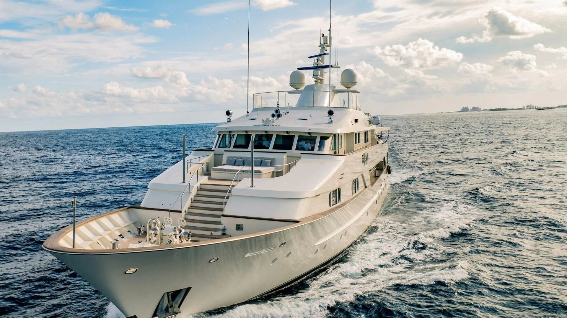 a white boat in the water aboard BG Yacht for Sale
