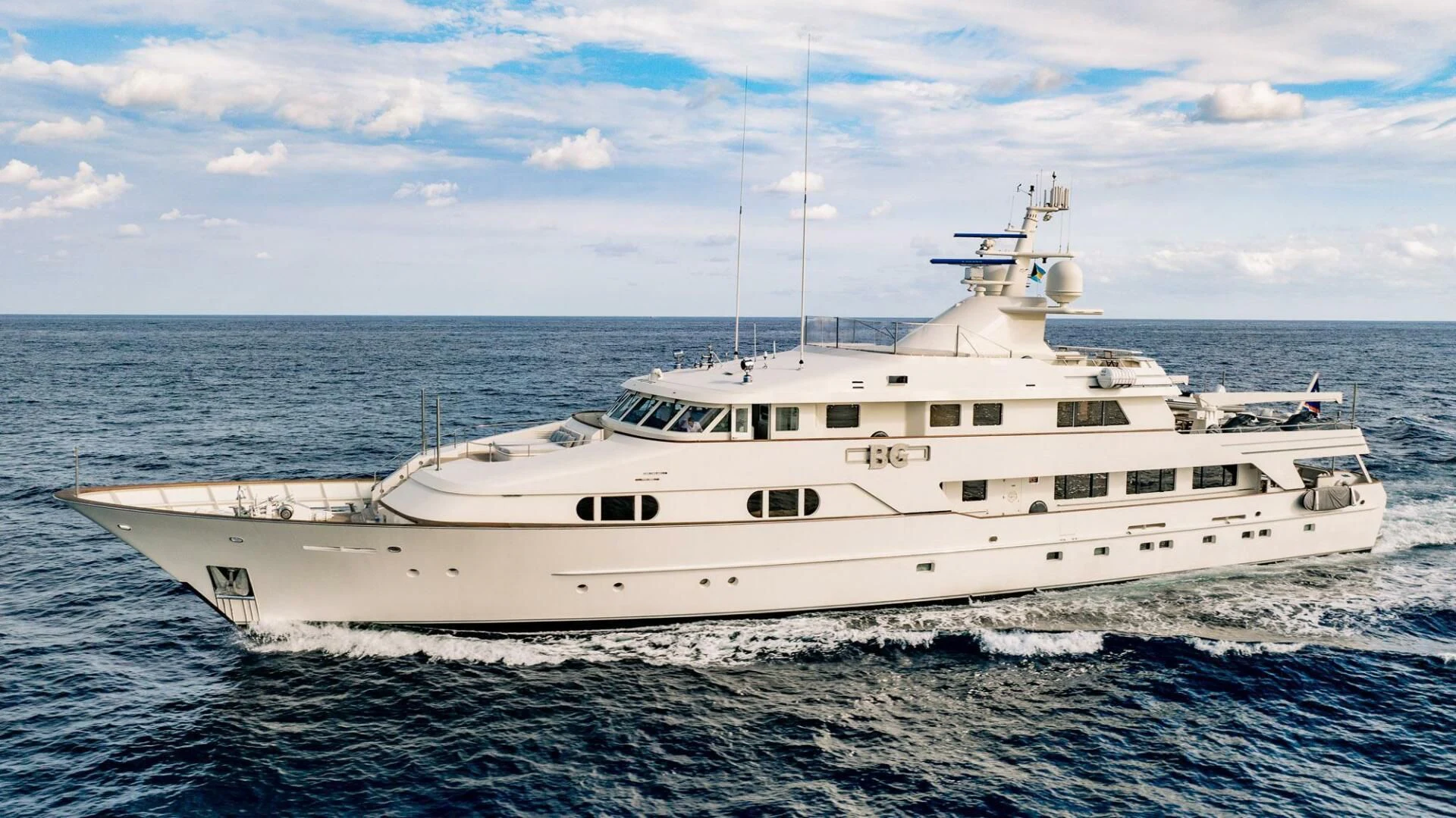 a large white ship in the water aboard BG Yacht for Sale