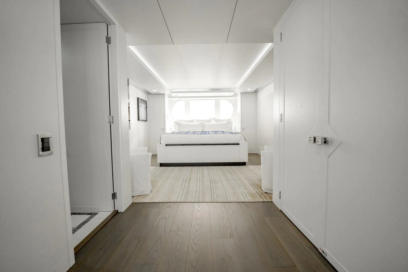 a room with a bed and a door aboard BG Yacht for Sale
