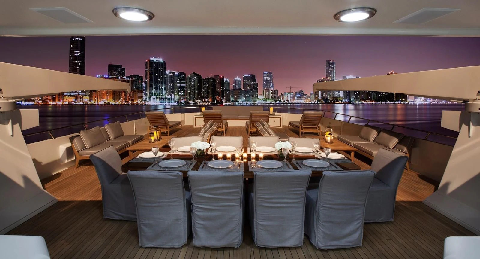 a large room with tables and chairs aboard BG Yacht for Sale