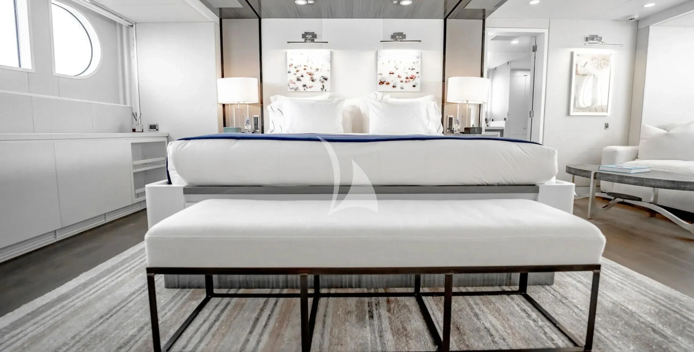 a large white bed in a room aboard BG Yacht for Sale