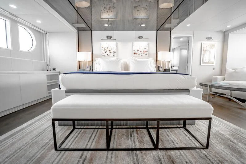 a large white bed in a room aboard BG Yacht for Sale