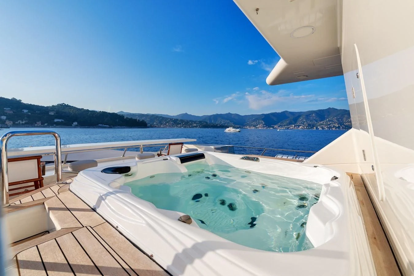 a pool on a deck overlooking a large body of water aboard BG Yacht for Sale