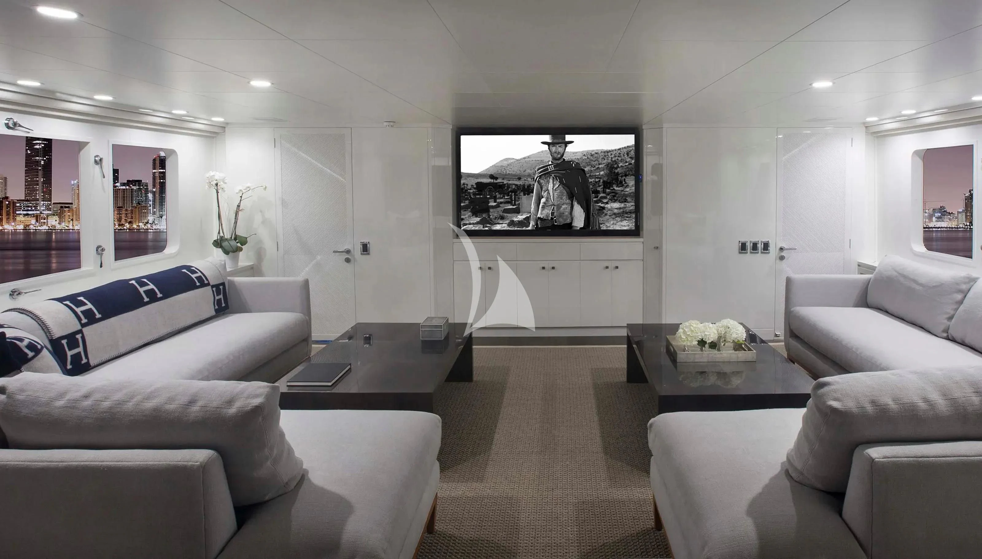 a living room with white furniture aboard BG Yacht for Sale